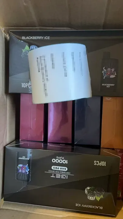 Genuine IGET Bar Pro 10000 Blueberry Raspberry order packed for dispatch — shipping label blurred for privacy