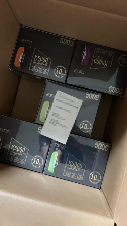 Genuine IGET Bar 3500 Grape Ice order packed for dispatch — shipping label blurred for privacy