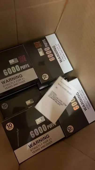 Genuine IGET Bar Plus + pods order packed for dispatch — shipping label blurred for privacy